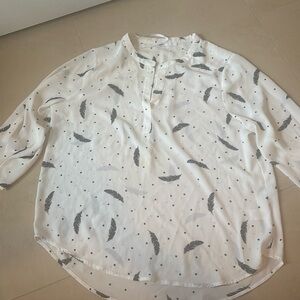 Cream blouse with black feathers size large